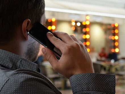 Man Talking On The Phone - Are Bluetooth Headphones Dangerous?!